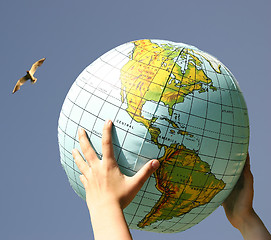 Image showing our world in the chilren's hand