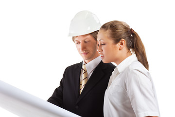 Image showing An architect wearing a hard hat and co-worker