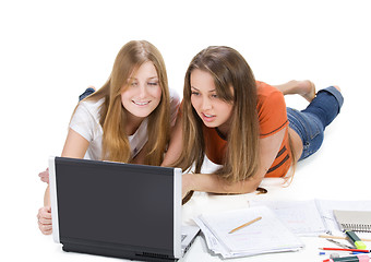 Image showing two young happy student girl work on laptop