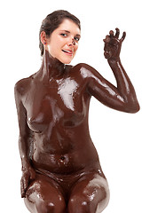 Image showing woman covered sweet cream chocolate