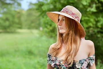 Image showing Young beautiful girl with hat posing outdoor