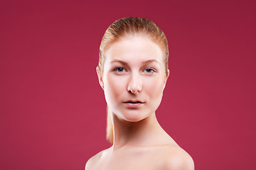 Image showing Portrait of a young lady on red