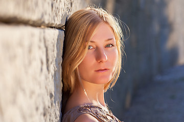 Image showing Young woman outdoors at sunset