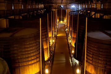 Image showing wine barrels in a winery, France