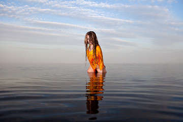 Image showing girl posing in the Water at sunset