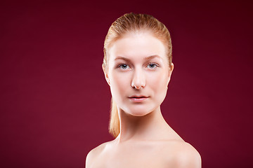 Image showing Portrait of a young lady on red