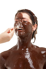 Image showing young woman having a chocolate face mask