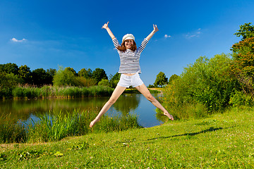 Image showing young woman exercising outdoor in summer