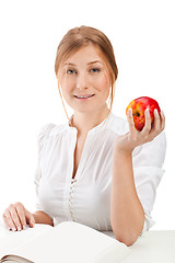 Image showing woman with apple and book