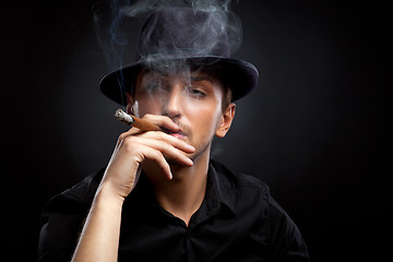 Image showing Gangster look. Man with hat and cigar.