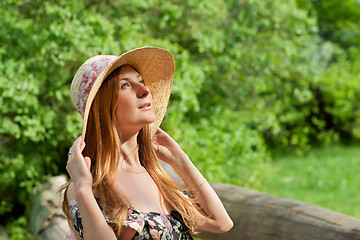 Image showing Young beautiful girl with hat posing outdoor