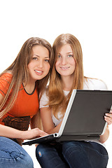 Image showing two young happy student girl work on laptop