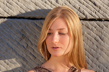 Image showing Young woman outdoors at sunset