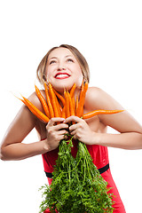 Image showing attractive woman holds bunch of carrots