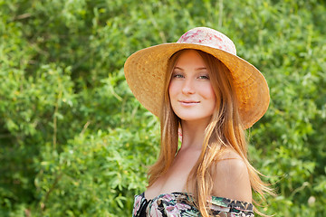 Image showing Young beautiful girl with hat posing outdoor