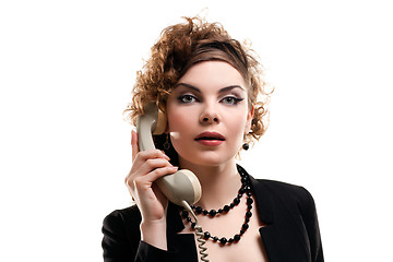 Image showing Businesswoman taking telephone call in office