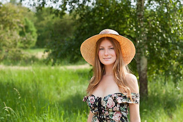 Image showing Young beautiful girl with hat posing outdoor