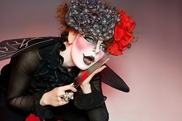 Image showing woman mime with knife