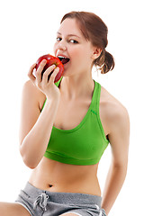 Image showing woman in sportswear with apple