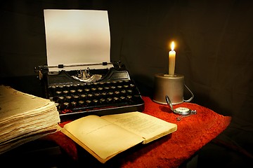 Image showing old typewriter, old book and candle