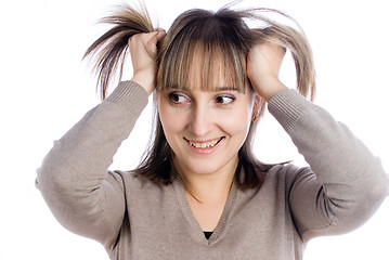 Image showing Pretty woman with hands in hair