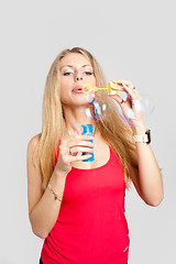 Image showing Pretty girl with soap bubbles