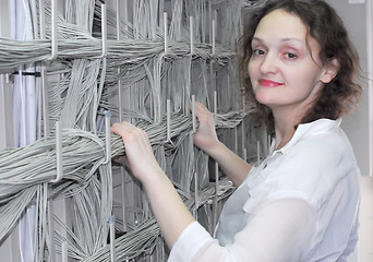 Image showing Woman working on telecommunication equipment