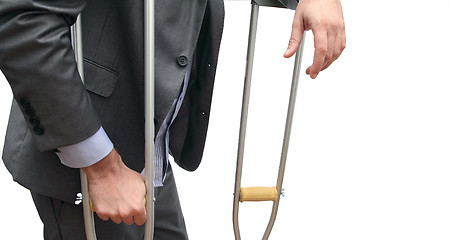 Image showing business and crutches