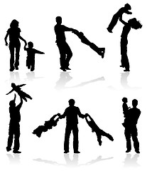 Image showing Silhouettes of parents with children