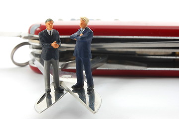 Image showing business people on penknife