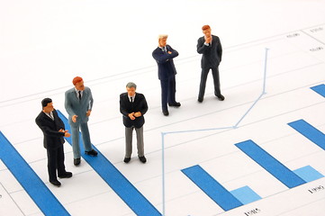 Image showing business man over economic chart