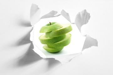 Image showing sliced apple and hole in paper