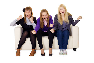 Image showing Jubilant young woman on sofa