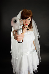 Image showing Young bride threatens us with a gun