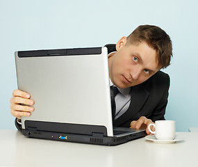 Image showing Young man looks negative sites on Internet