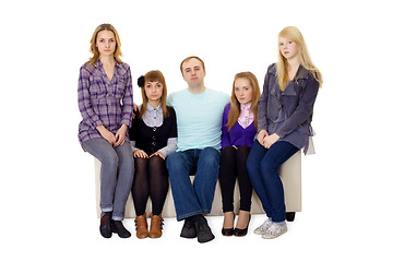 Image showing An ordinary large family sitting on couch