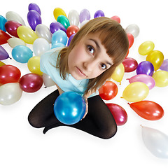 Image showing Young woman sitting on floor among balloons