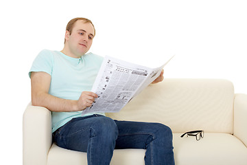 Image showing Man reads newspaper