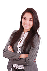Image showing portrait of a happy young business woman standing with folded ha