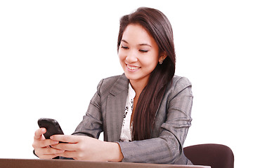 Image showing beautiful asian bussines woman using cellphone 