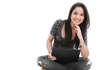 Image showing happy young beautiful woman with laptop 