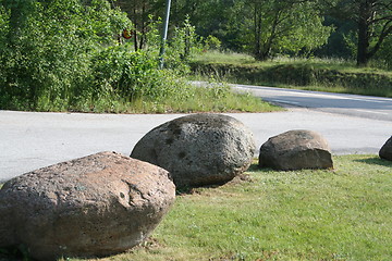 Image showing Big stones beside the way