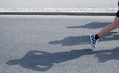 Image showing Shadows of people running Stockholm marathon