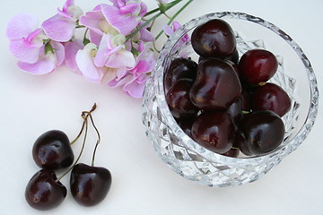 Image showing Cherries and sweet peas