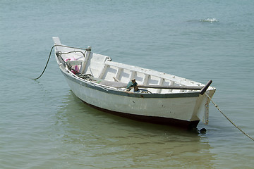 Image showing Small, white, wooden fishing boat