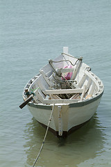 Image showing Small, white, wooden fishing boat