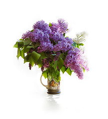 Image showing Bouquet of a lilac in a bright jar on light tones.