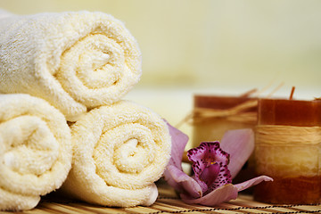 Image showing Still-life from towels and candles on bamboo mat