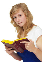 Image showing The girl - student reading textbook