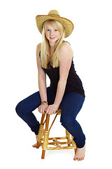 Image showing Attractive girl in the wicker hat